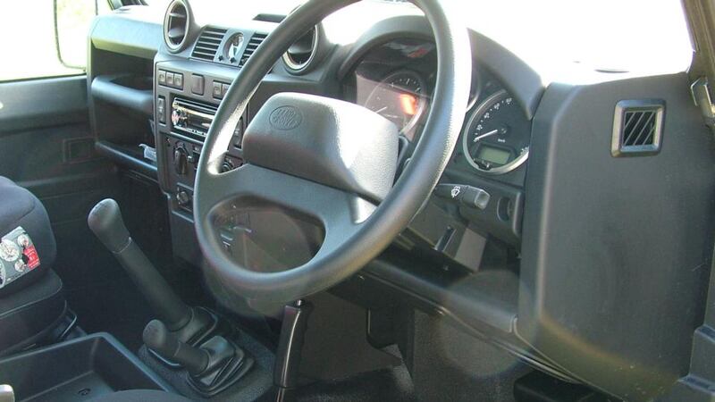 Land Rover Defender: The driving position is cramped and offset, and the handbrake, mounted down and to the left, constantly nibbles at your left calf. The steering wheel is vast, but you cant actually move it properly because your right elbow is jammed against the door, so you have to shuffle it, police standards roadbook-style.