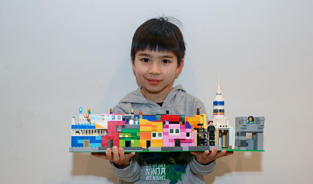 Last year's Heritage at Play winner Luke Molony with his model of Kinsale, which features the Kinsale giant and a church whose steeple is made using spaceship parts. Photograph: Vicky Comerford