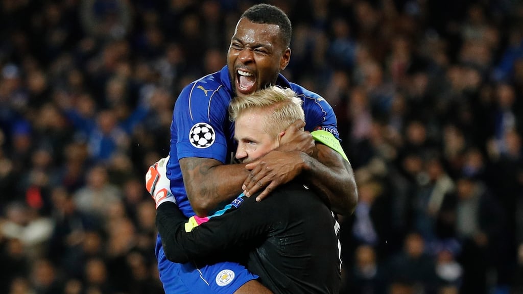 Leicester City’s Wes Morgan celebrates with Kasper Schmeichel after the goalkeeper’s penalty save against Sevilla in the Champions League last-16 game this week. Photograph: Darren Staples/Reuters