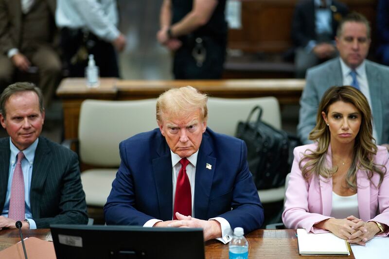 Former president Donald Trump sits at the defence table with his lawyers Christopher Kise and Alina Habba. Photograph: Eduardo Munoz Alvarez/AP