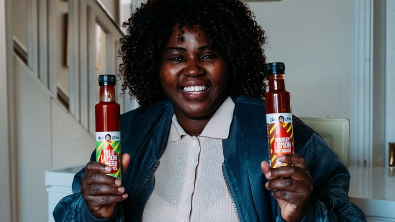 Ellie Kisyombe with the African-inspired, Irish-made hot sauces she makes, a percentage of the profits from which go to Our Table.