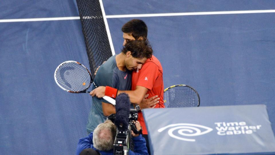 Rafael Nadal of Spain and Novak Djokovic of Serbia embrace at the net. Photograph: The New York Times