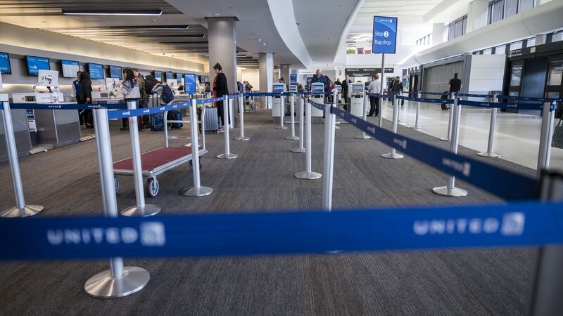 An empty check in area  at the United Airlines Holdings Inc domestic check-in area at San Francisco International Airport in San Francisco on Thursday. Photographer: David Paul Morris/Bloomberg