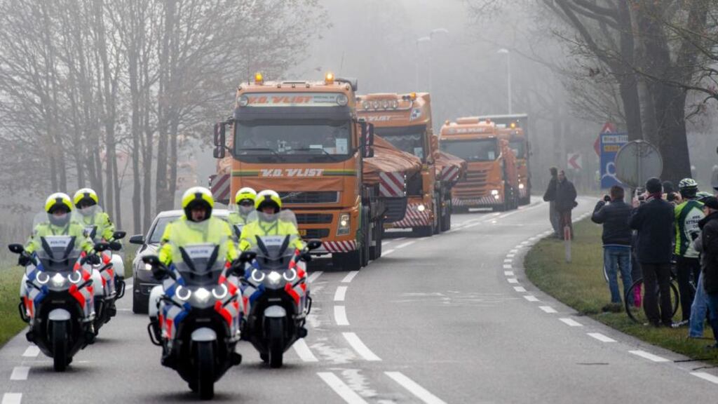 Trucks carrying the wreckage of the Malaysia Airlines aircraft MH17 that crashed in Ukraine arrive at Gilze-Rijen airbase in Gilze-Rijen in The Netherlands. Photograph: Robin van Lonkhuijsen/EPA