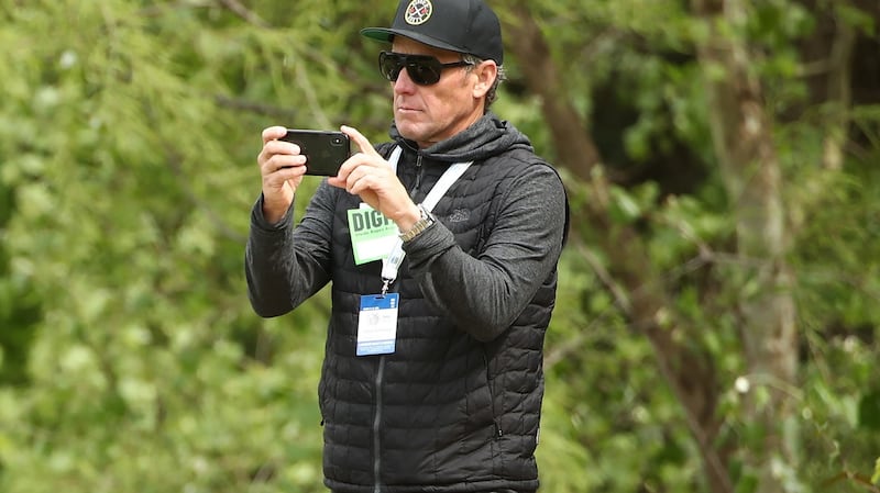 Armstrong watches on during the final of last year’s WGC Matchplay golf tournament. Photo: Ezra Shaw/Getty Images