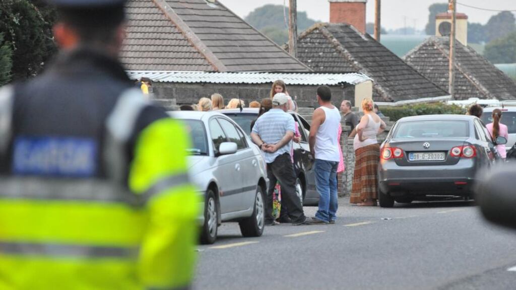 The scene in Charleville, Co Cork yesterday, as dozens of relatives and friends gathered to comfort the O’Driscoll family after twin brothers Tom and Paddy were found dead in their home. Photograph: Daragh McSweeney/Provision