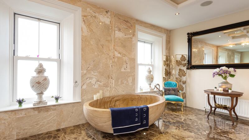 Bathroom with bath carved from a single piece of Italian sandstone.
