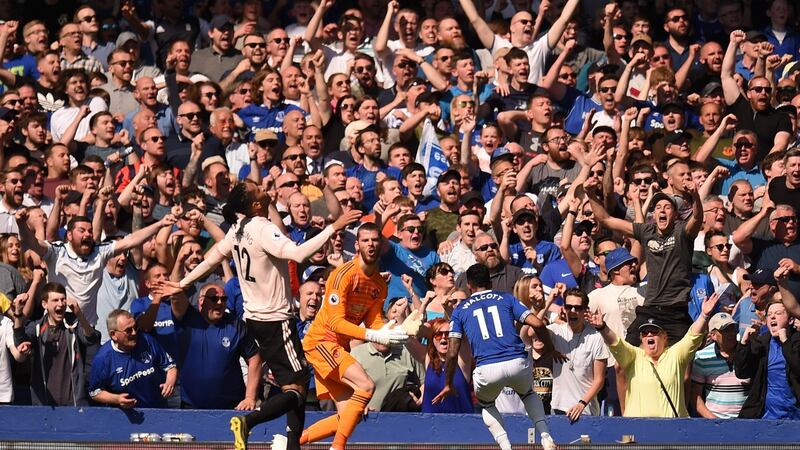 Theo Walcott celebrates scoring Everton’s fourth goal. Photograph: Getty Images