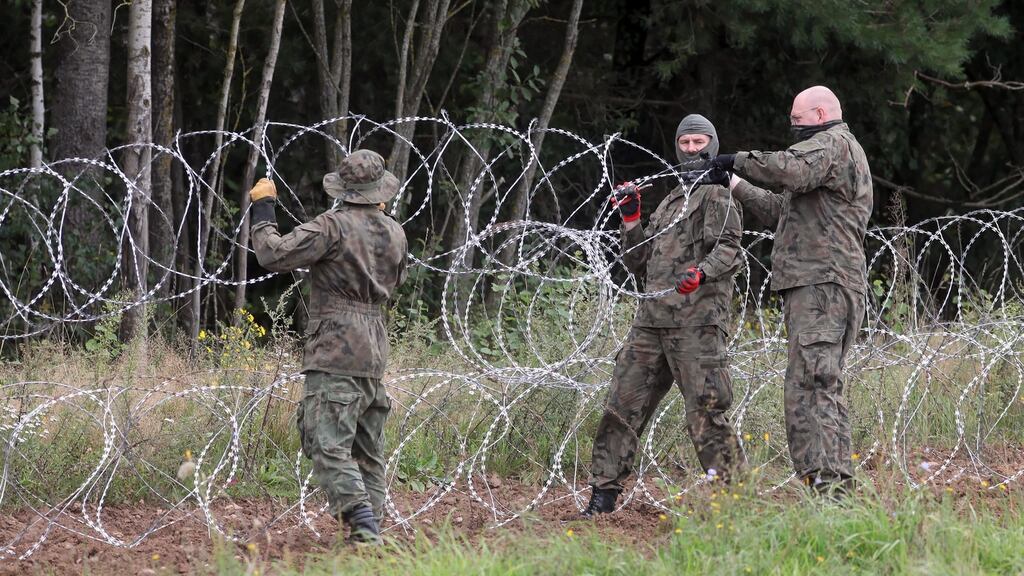 Barbed wire installed on the border between Poland and Belarus near the town of Grzybowszczyzna in northeast Poland. Photograph: Artur Reszko/EPA