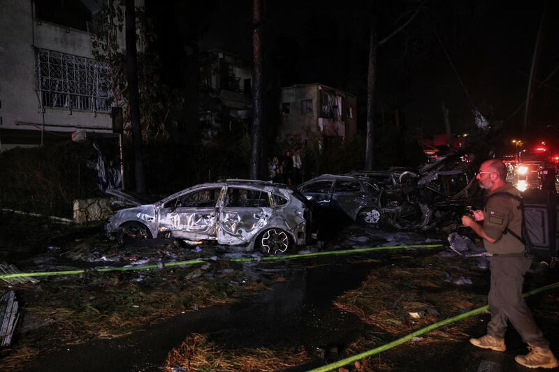 Israeli emergency and security service members at a site hit by an Iranian rocket in the city of Haifa. Photograph: Ahmad Gharabli/Getty Images