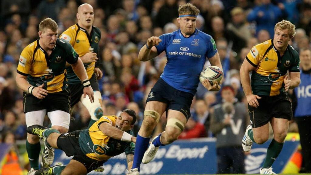 Leinster’s Jamie Heaslip skips past Kahn Fotuali’i of Northampton Saints. Photograph: Ryan Byrne/Inpho