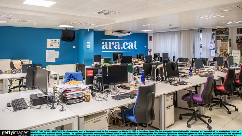 Empty desks are seen at the newsroom of the Ara newspaper in Barcelona, Spain. Photograph: David Ramos/Getty Images