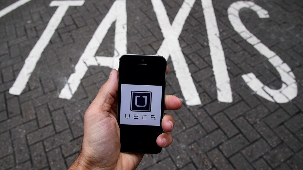 The employment tribunal ruled Uber should should pay  its drivers  the minimum wage and holiday pay. Photograph: Toby Melville/Reuters