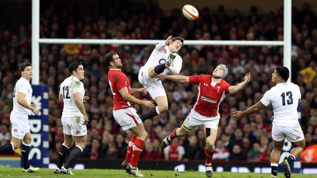 England’s Alex Goode and Jamie Roberts of Wales in last March’s game at the Millennium Stadium. Photograph: Dan Sheridan/Inpho