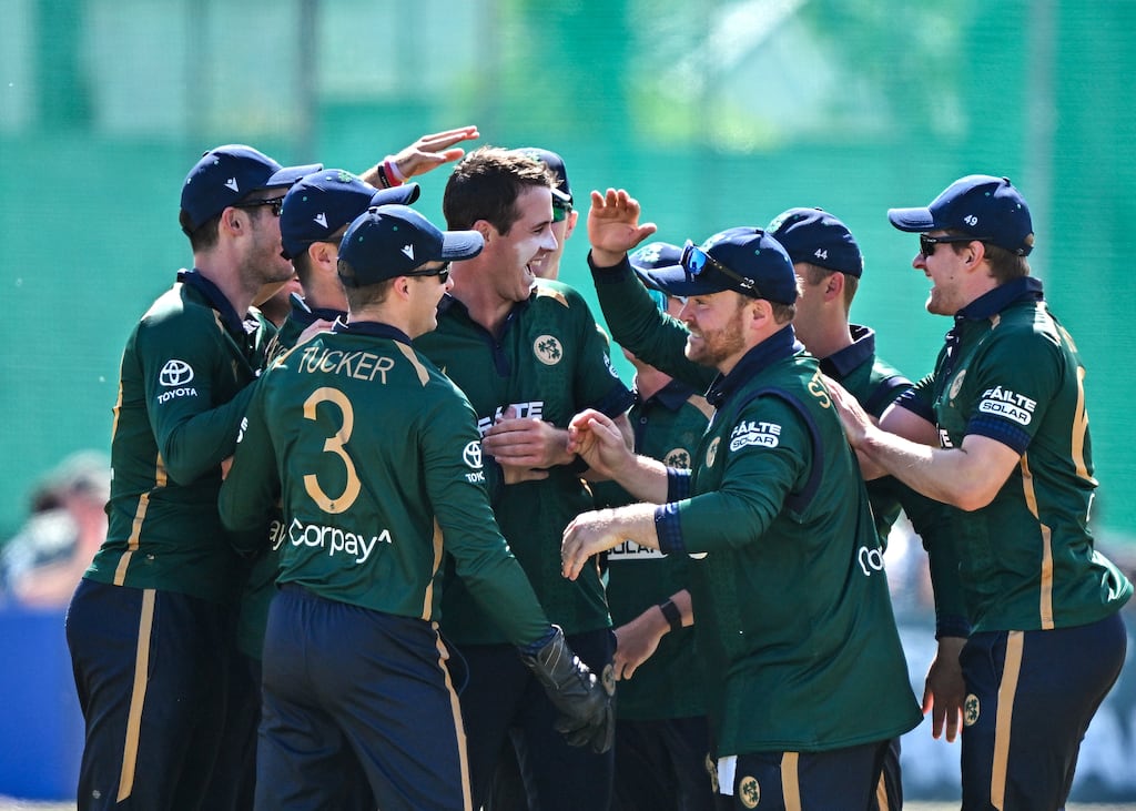 Ireland bowler Tom Mayes (centre) is congratulated by his team-mates after taking the wicket of West Indies' Shai Hope during the first ODI at Clontarf Cricket Club. Photograph: Sam Barnes/Sportsfile