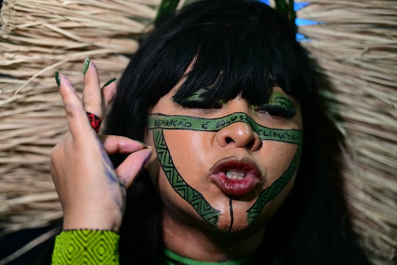 Brazilian member of the Chamber of Deputies, Celia Xakriaba Nunes Correa, gestures as she speaks to the press during COP30. Photograph: Pablo Porciuncula/AFP via Getty Images