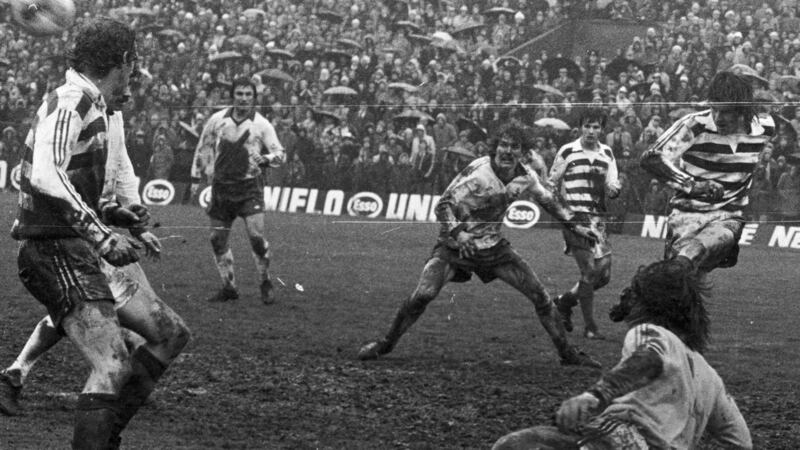 Rain splashed and mud splattered players in Shamrock Rovers’ goalmouth as Noel Synott kicks clear during the 1983 FAI Cup final against Sligo Rovers. Photo: Eddie Kelly/The Irish Times