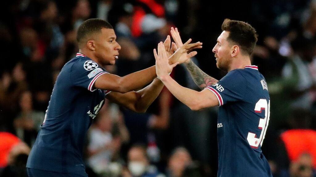 Lionel Messi celebrates a goal with Paris Saint-Germain team-mate Kylian Mbappé during the Champions League match against RB Leipzig at Parc des Princes. Photograph: Christophe Petit Tesson/EPA