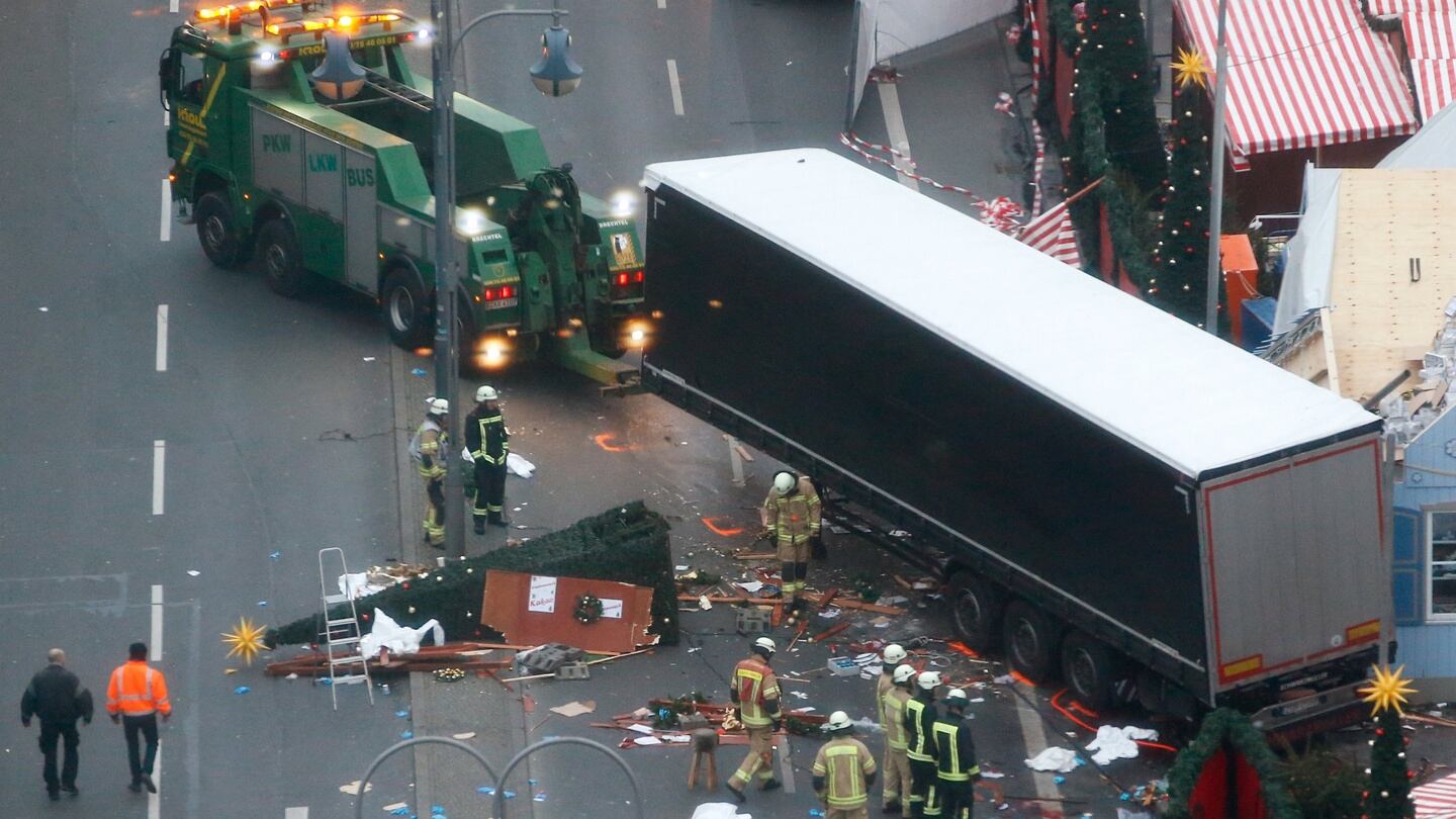 Rescue workers tow the truck away on Tuesday morning. Photograph: Fabrizio Bensch/Reuters