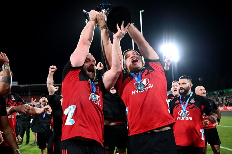 Oliver Jager and Tamaiti Williams of the Crusaders hold the trophy aloft after winning the Super Rugby Pacific Final against Chiefs at FMG Stadium Waikato in Hamilton, New Zealand. Photograph: Hannah Peters/Getty Images
