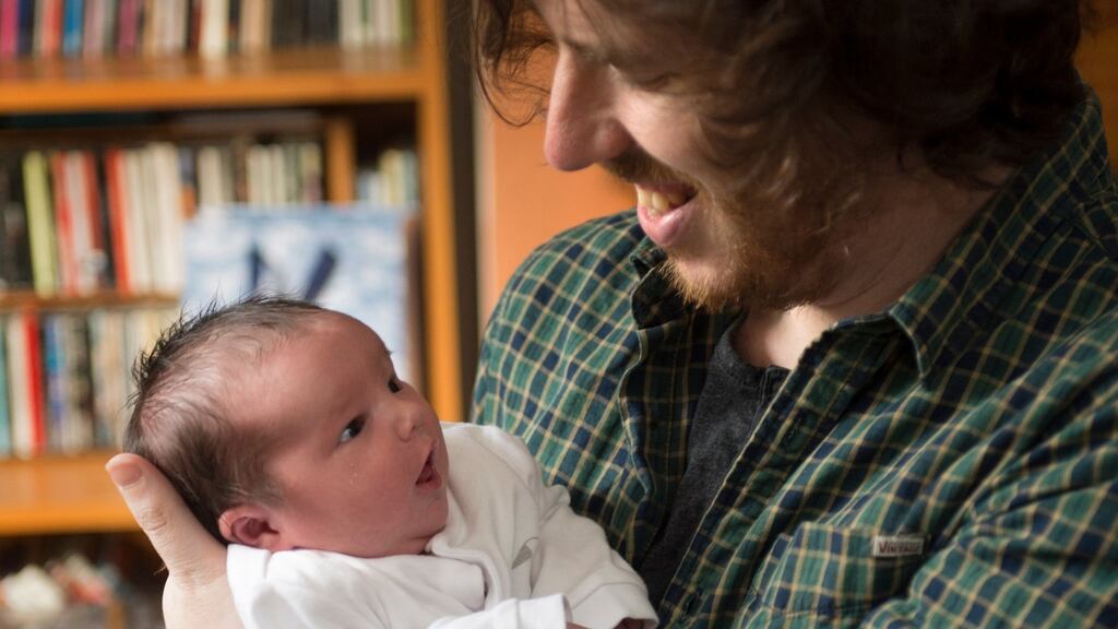 Writer, Joe Griffin and his (six day old) daughter Alice, at home in Cabra, Dublin.Photograph: Dara Mac Dónaill