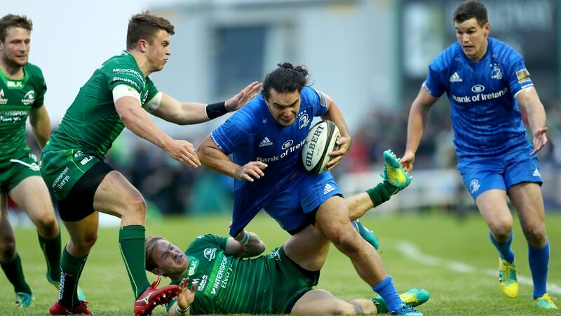 Connacht’s Tom Farrell and Kieran Marmion tackle Lowe during the previous week’s game. Photo: James Crombie/Inpho