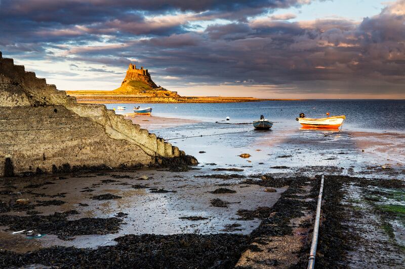 Holy Island harbour and pier in Northumberland. Photograph: Chris Lishman/Getty