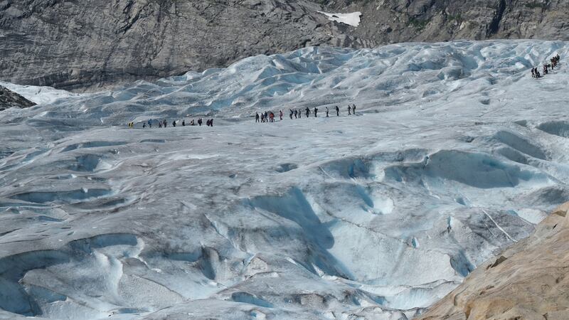 Visitors on a guided tour walk on the melting Nigard glacier (Nigardsbreen) on August 10th, 2020, near Gaupne, Norway. Photograph: Sean Gallup/Getty