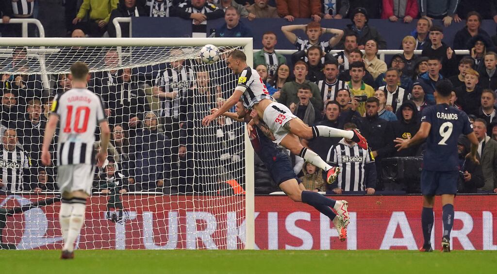 Newcastle United's Dan Burn scores his side's second goal during the Champions League Group F match against Paris Saint-Germain at St James' Park. Photograph: Martin Rickett/PA Wire