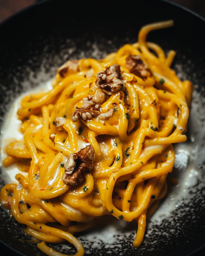 Bigoli pasta served in a pumpkin cream sauce, gorgonzola fondue and toasted walnuts.