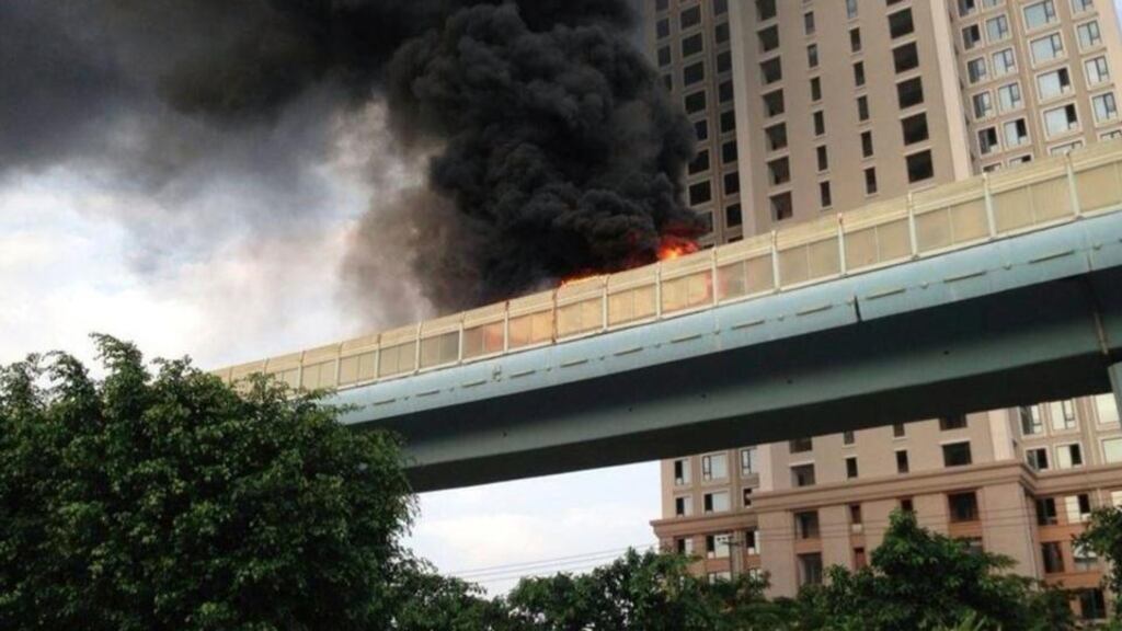 Smoke spirals from a bus on fire in Xiamen, Fujian province, yesterday, in which dozens of people were killed. Photograph: Reuters