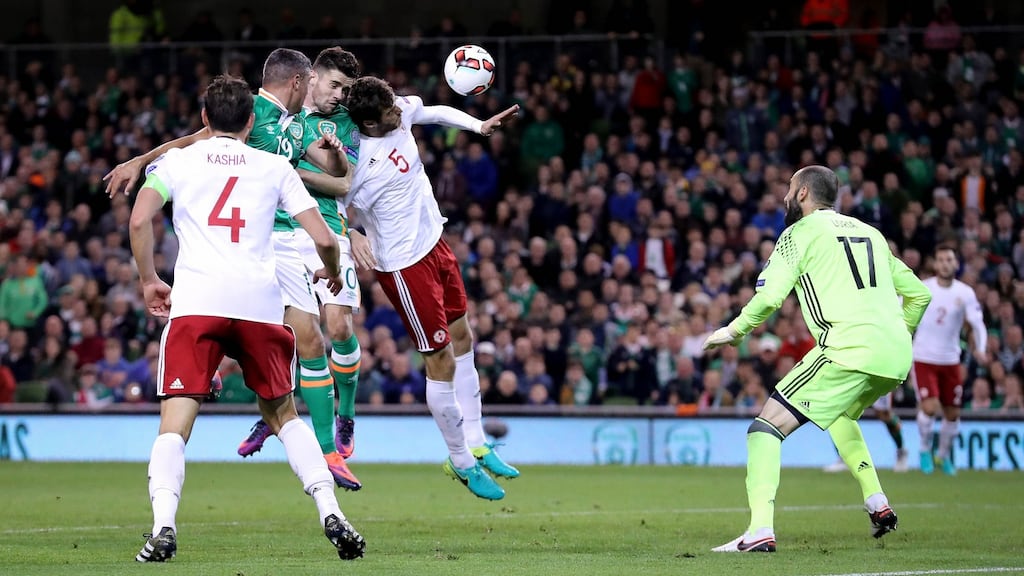 Robbie Brady suffered concussion after this clash of heads with Georgia’s Solomon Kvirkvelia. Photograph: Ryan Byrne/Inpho