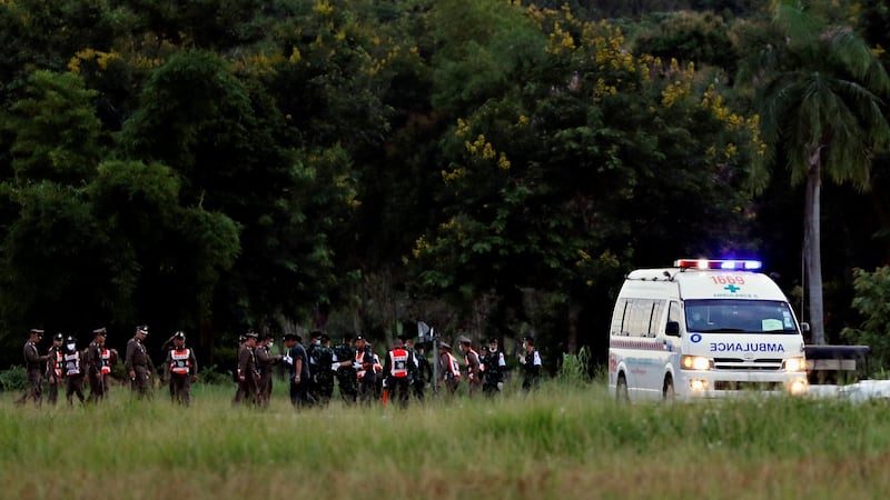 An ambulance carrying rescued schoolboys leaves a military airport in Chiang Rai, Thailand. Photograph: Tyrone Siu/Reuters