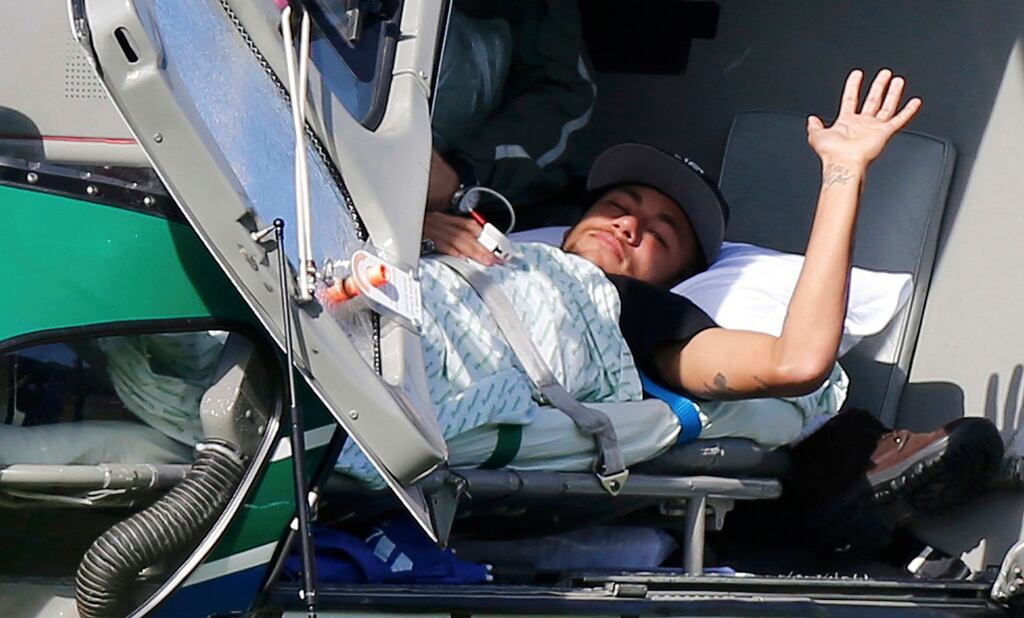 Neymar waits to be airlifted home from Brazil’s training camp inTeresopolis following his back injury which occured in the quarter-final against Columbia. Photograph: Reuters