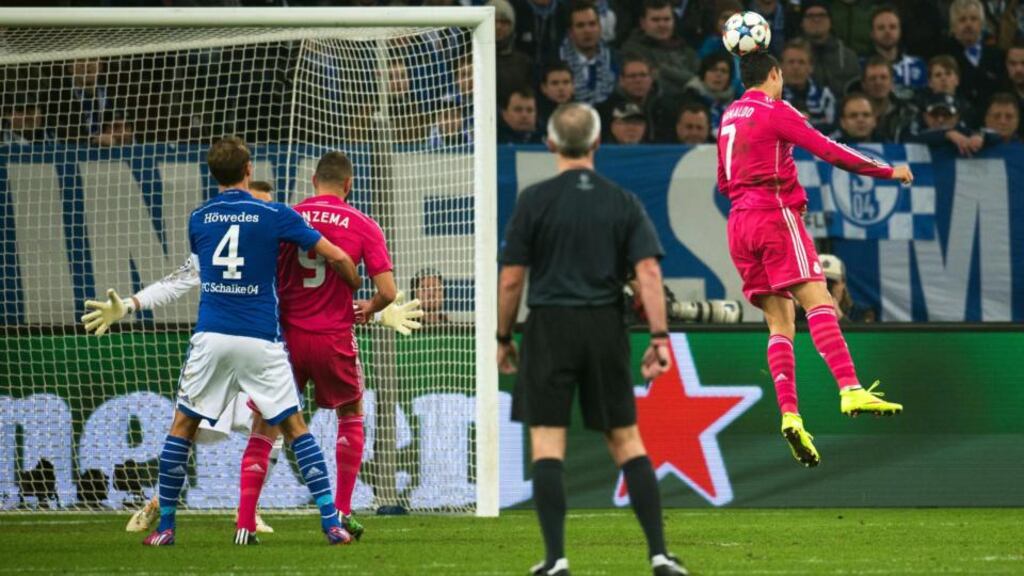 Real Madrid’s Cristiano Ronaldo heads home a goal during the Champions League round of 16 first leg match against Schalke in Gelsenkirchen. Photograph: Bernd Thissen/EPA