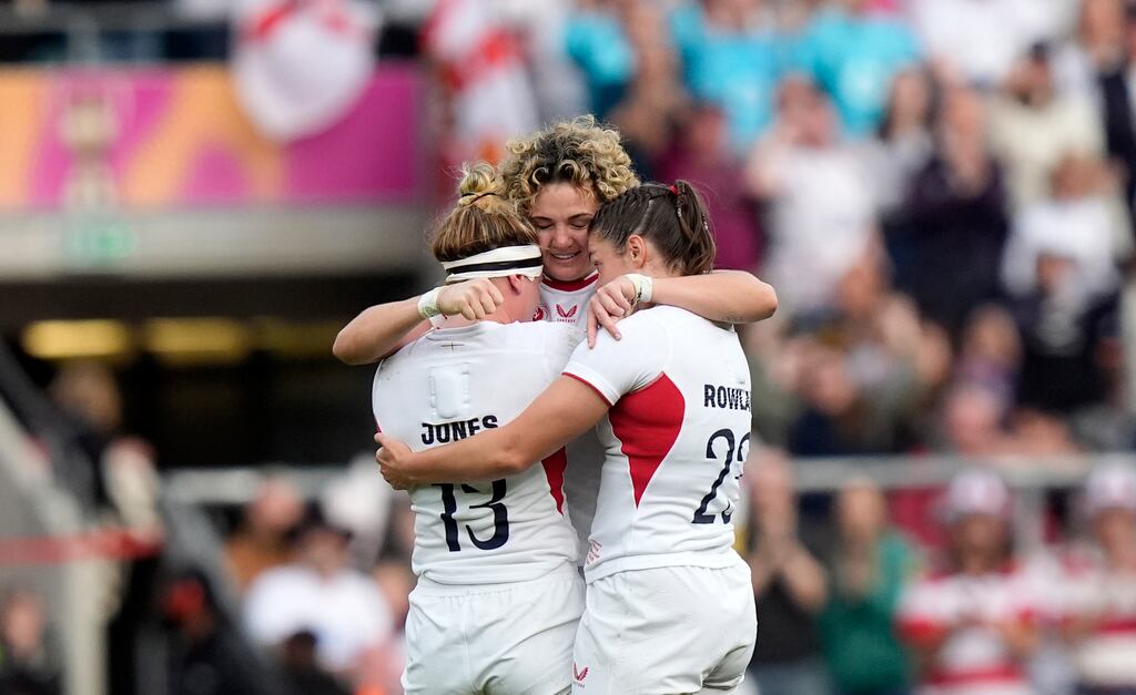 England's Megan Jones, Ellie Kildunne and Helena Rowland celebrate after the final whistle. Photograph: Andrew Matthews/PA
