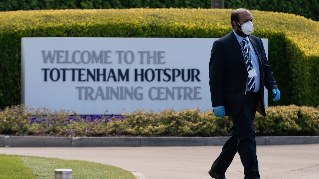 A member of staff wears a face mask at Tottenham’s training ground. Photograph: Will Oliver/EPA