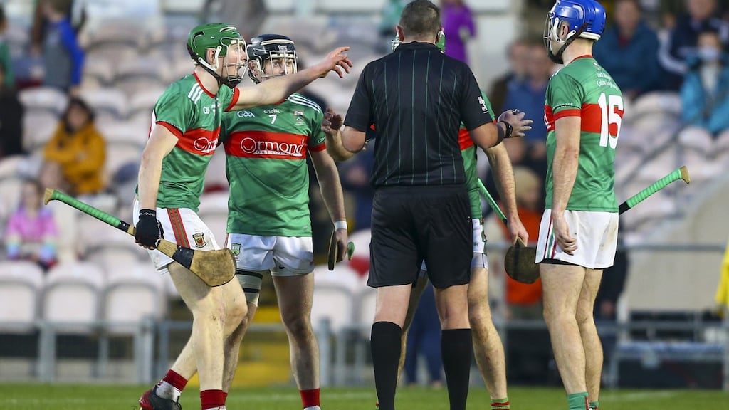 Loughmore-Castleiney’s players remonstrate with referee Conor Doyle at the final whistle after not being awarded a line ball. Photograph: Ken Sutton/Inpho