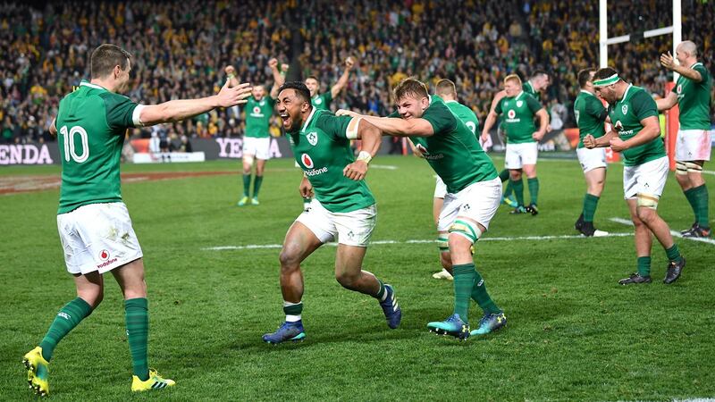 Johnny Sexton celebrates with Bundee Aki and Jordi Murphy. Photograph: Reuters