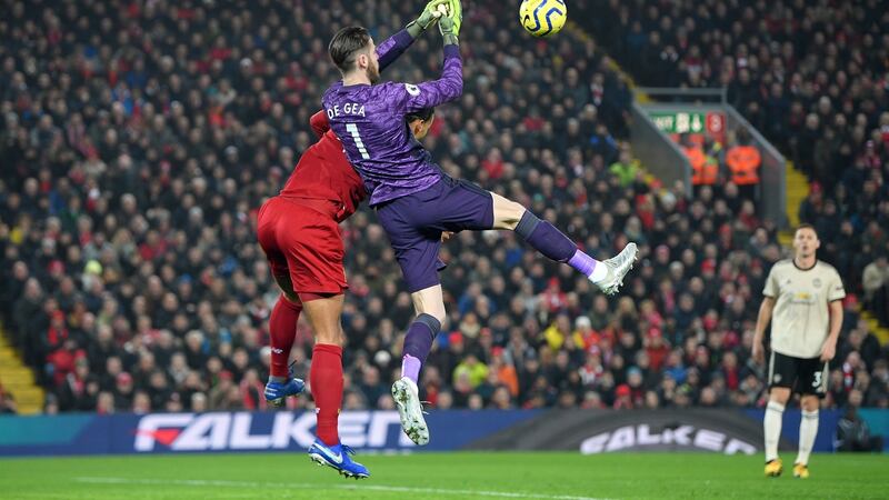 De Gea is fouled by van Dijk in the lead up to a disallowed goal. Photo: Michael Regan/Getty Images