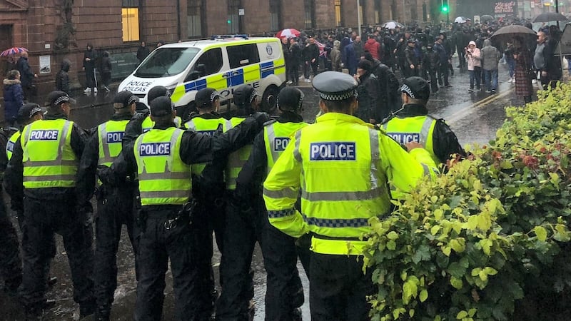 Police block Govan Road, Glasgow after a counter-protest against a planned march by the James Connolly Republican Flute Band became disruptive. Photograph: @JustShelbyMay/PA Wire