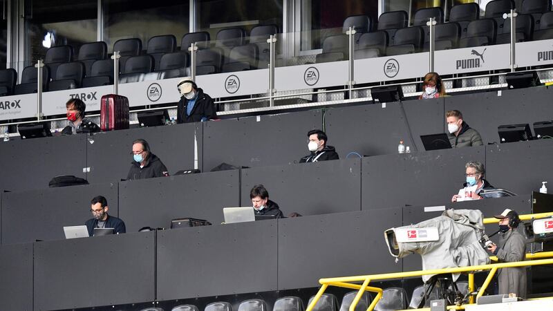 Journalists on the press tribune wear masks. Photo: Martin Meissner/EPA
