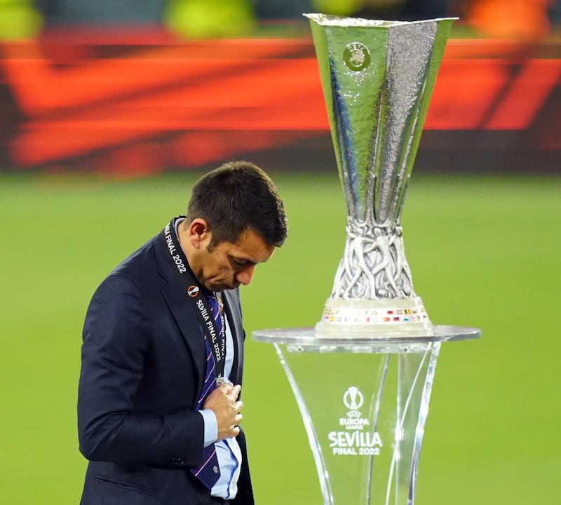 Rangers manager Giovanni van Bronckhorst walks past the trophy following defeat in the UEFA Europa League final. Photograph: Adam Davy/PA Wire