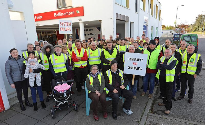 Ballinamore residents protest outside the apartment complex earmarked as a direct-provision centre for 130 refugees. Photograph: Lorraine Teevan