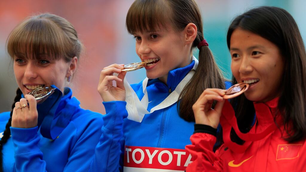 Anisya Kirdyapkina, left, with her silver medal for the Women’s 20 kilometres race walk during the World Athletics Championships in Moscow in 2013. Photograph: Jamie Squire/Getty Images