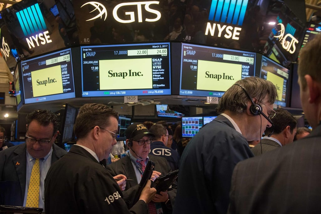 Traders work on the floor during the Snap Inc IPO at the New York Stock Exchange. Photograph: Getty Images