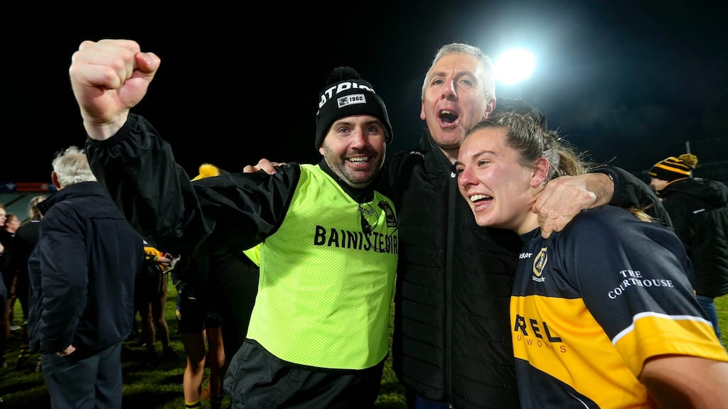 Mourneabbey’s manager Shane Roynane and Niamh O’Sullivan celebrate with supporters at the final whistle. Photograph: Lorraine O’Sullivan/Inpho
