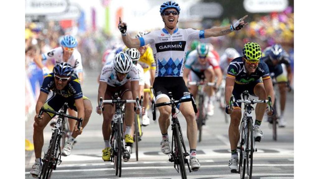 Garmin-Cervelo rider Tyler Farrar (C) of the US celebrates as he crosses the finish line flanked by Movistar rider Jose Rojas (R) of Spain and Vacansoleil rider Romain Feillu of France after the third stage of the Tour de France. Photograph: Denis Balibouse/Reuters