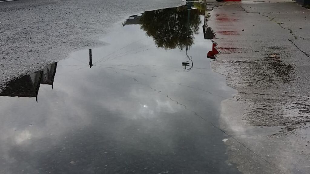 One family affected said the ground had appeared to bulge during the flood, with cracked pavements shifting and the garden wall moving. Photograph: Frank Miller/The Irish Times