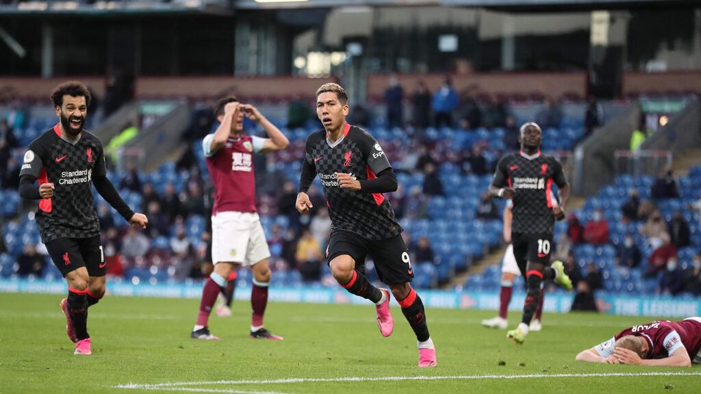 Liverpool’s Roberto Firmino celebrates scoring his side’s first goal during the Premier League win over Burnley. Photo: Martin Rickett/AFP via Getty Images